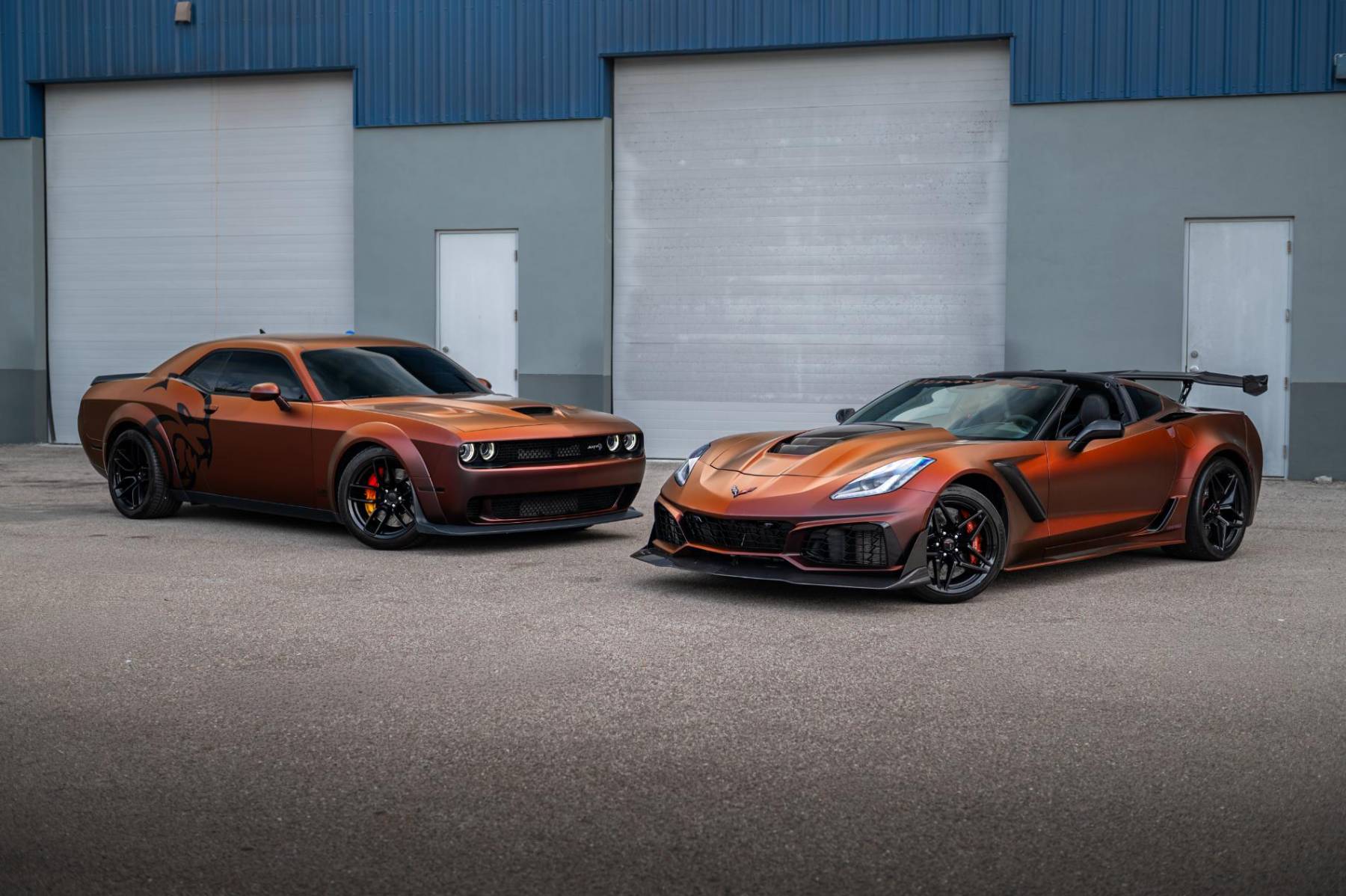 Orange-wrapped Dodge Challenger and Corvette ZR1